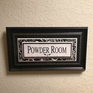 Black framed powder room sign